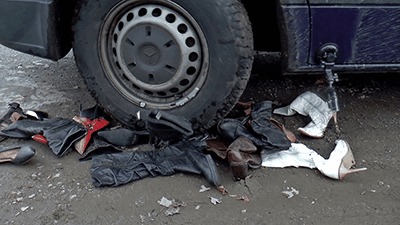 Shoes Crushed Under Muddy Tires