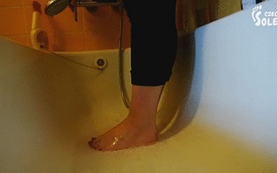 Youthful Girl Washing And Brushing Her Bare Feet